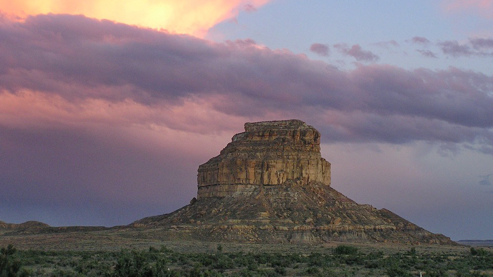 Fajada Butte in Chaco National Historical Park against a hazy sunset