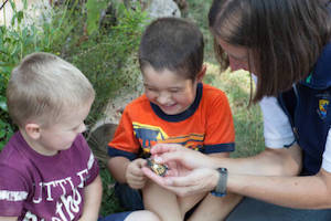 Biologist teaches children about the Monarch butterfly